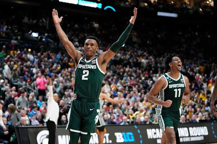 Michigan State Spartans guard Tyson Walker (2) and guard A.J. Hoggard (11) celebrate their 69-60 win over the Marquette Golden Eagles during the second round of the NCAA men's basketball tournament at Nationwide Arena.